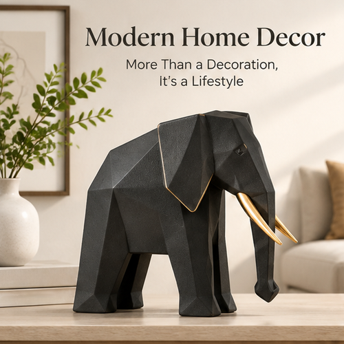 Black and gold elephant figurine styled beside books and greenery in a modern living room