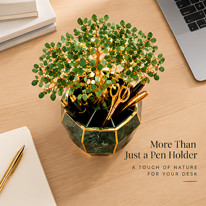 Top view of the tree pen holder showing compartments with pens and scissors beside a laptop
