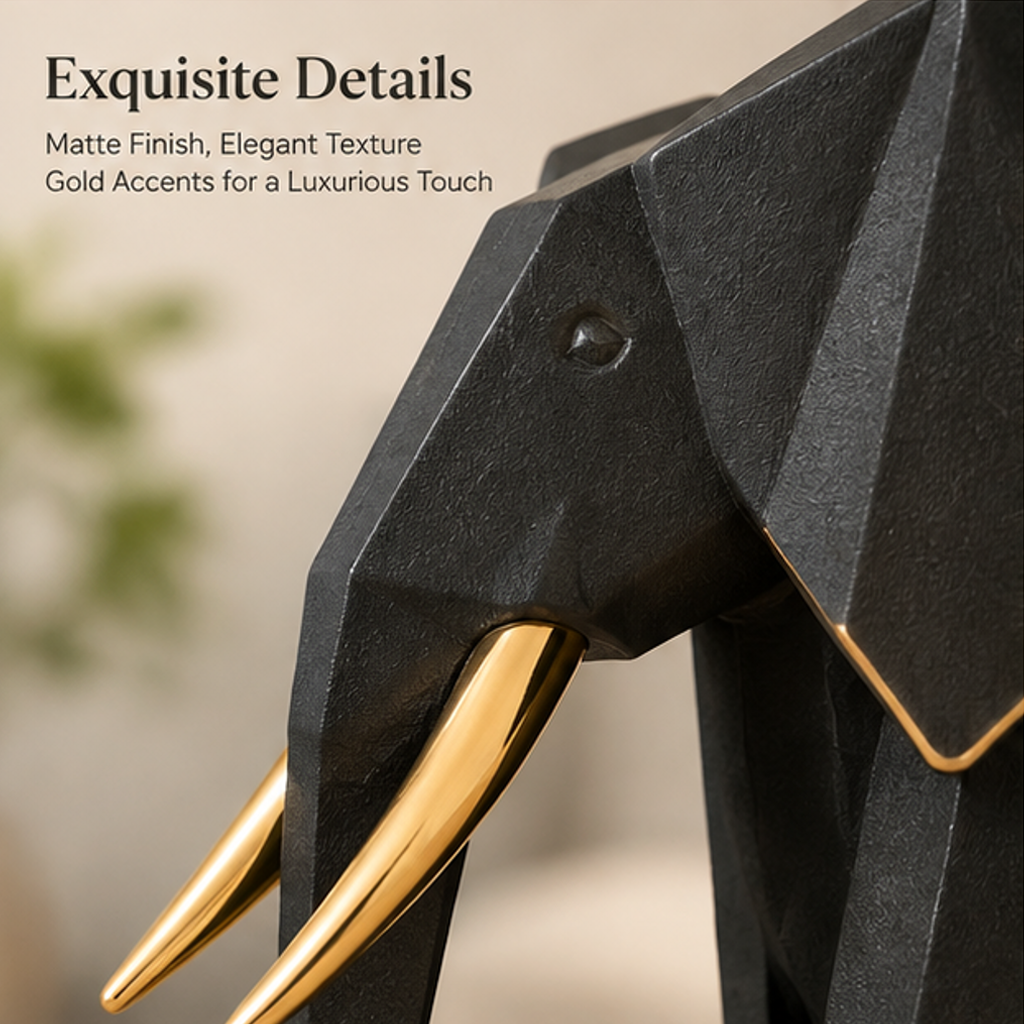 Close-up of elephant head showing matte black texture, gold-toned tusks, and fine ear edging