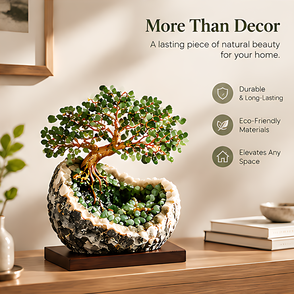 Green leaf tree sculpture displayed on a console beside books and neutral home accessories