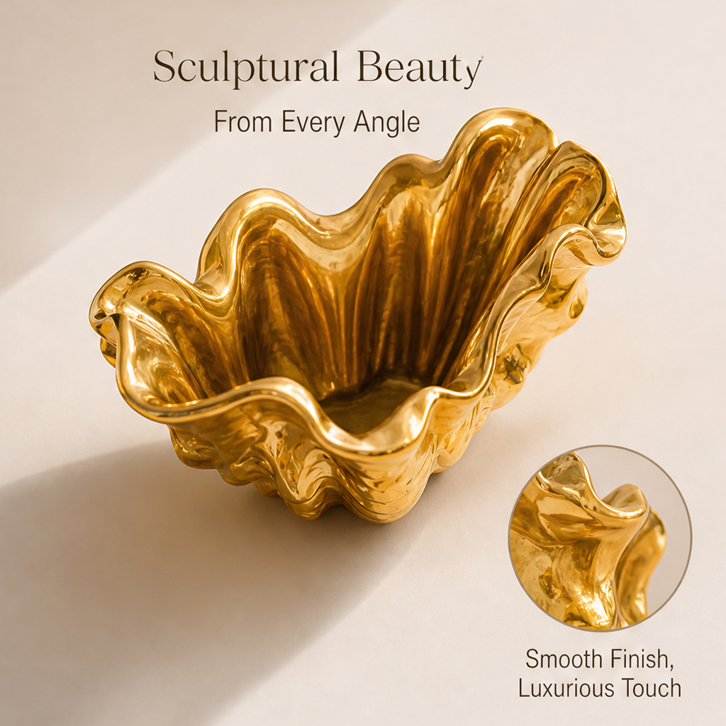 Empty shell-shaped planter showing the sculptural interior, undulating rim, and smooth gold-toned finish