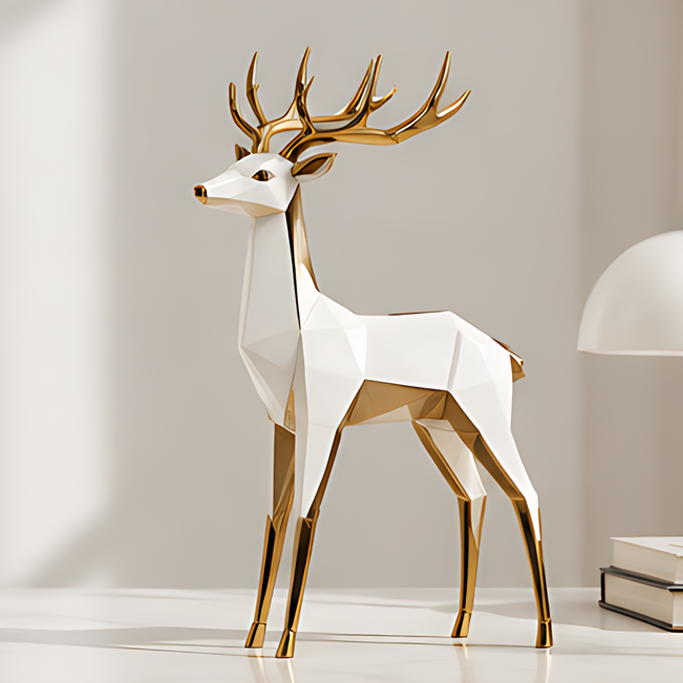 White and gold geometric deer figurine with branching antlers and slender legs on a light tabletop
